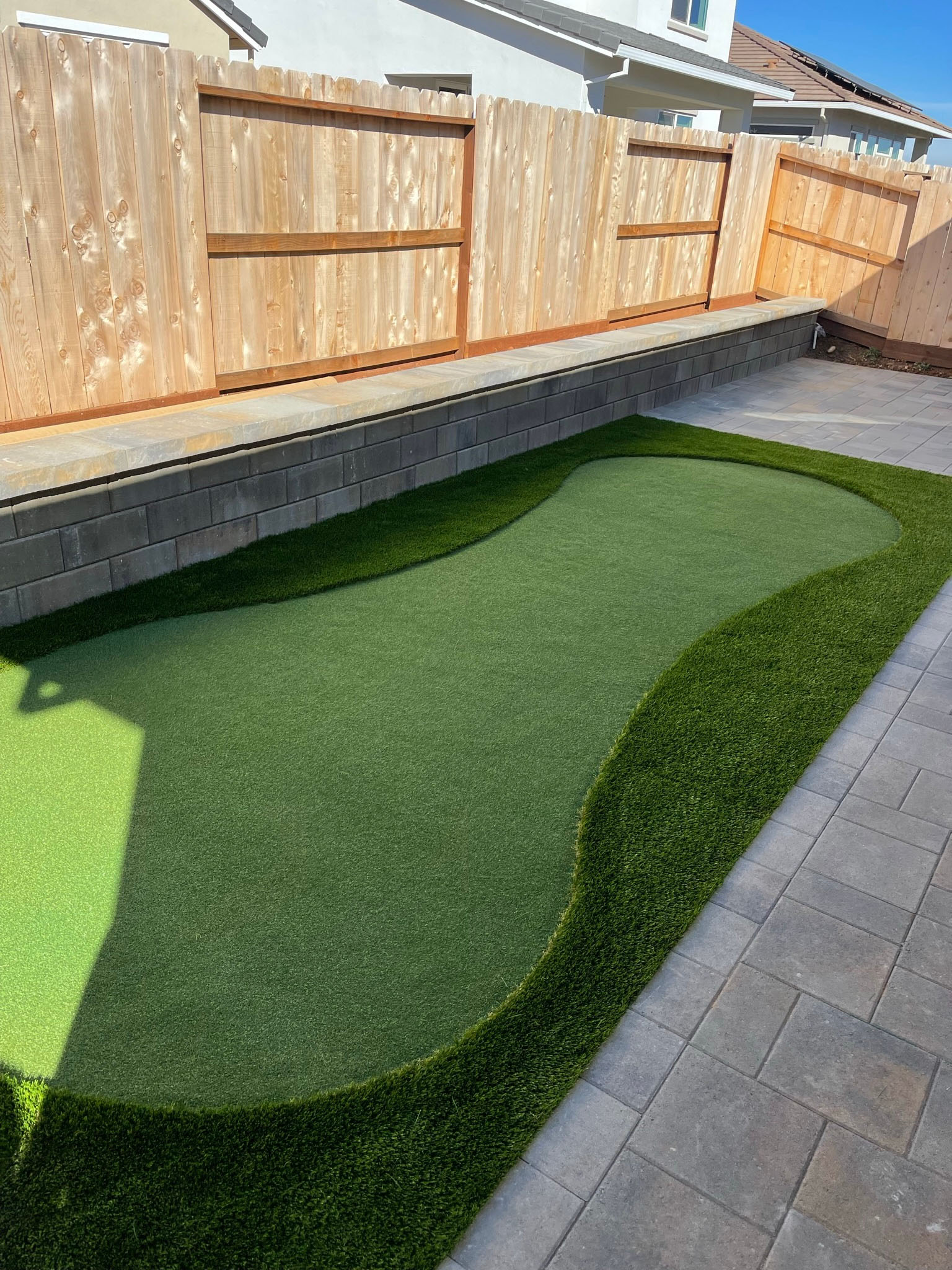 Stone fire feature with woven lounge seating